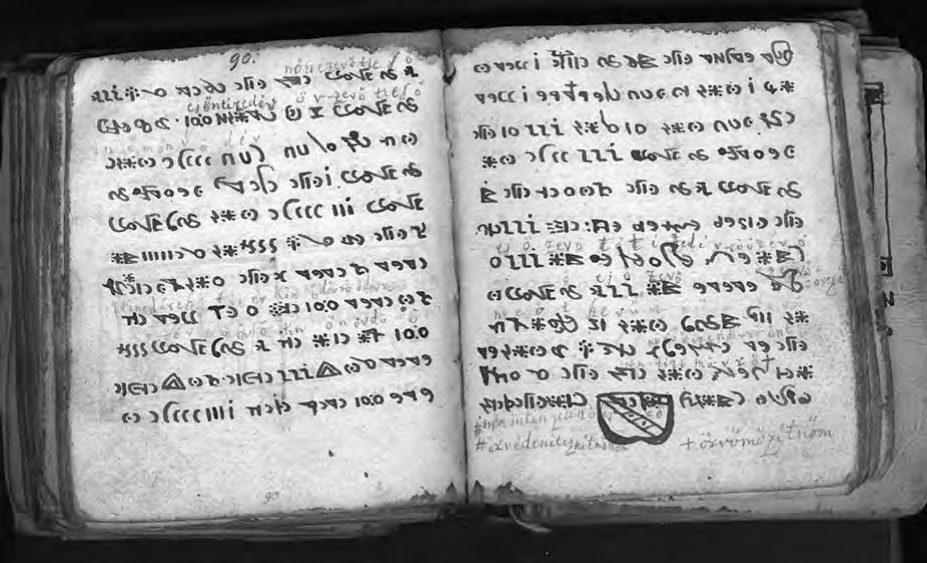 Another two-page spread, showing rows of symbols with later annotations in Latin
      script in the margins and a small shield-shaped drawing.
